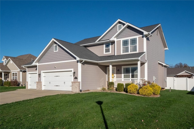 craftsman-style house featuring a front yard, a porch, and a garage