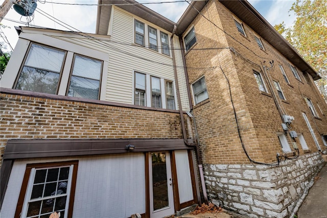 view of property exterior featuring french doors