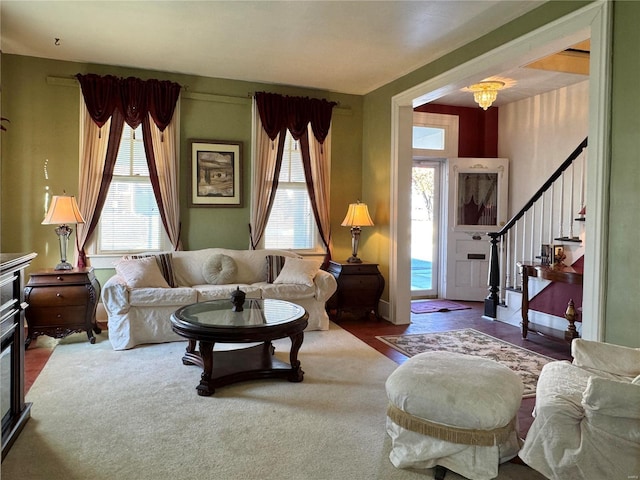 living room with carpet floors and stairway