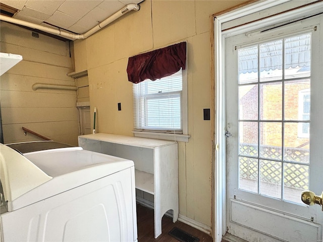 clothes washing area featuring laundry area, washer / clothes dryer, and visible vents