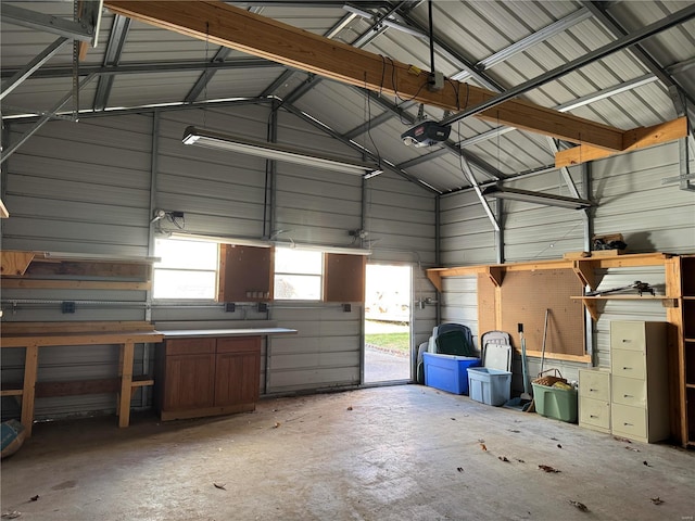 garage with metal wall and a garage door opener