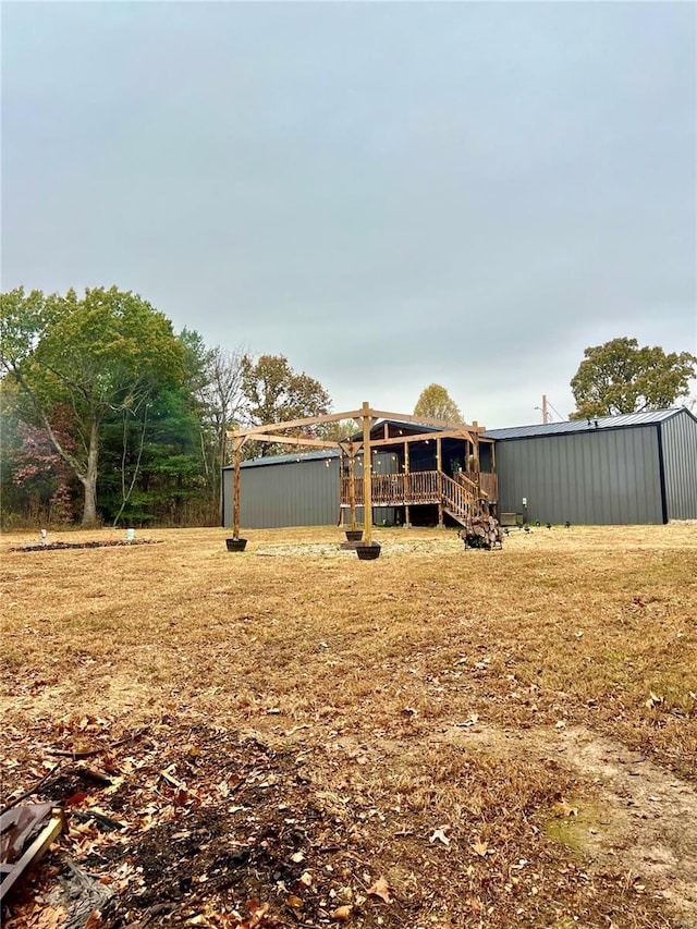 view of yard featuring a shed and a deck