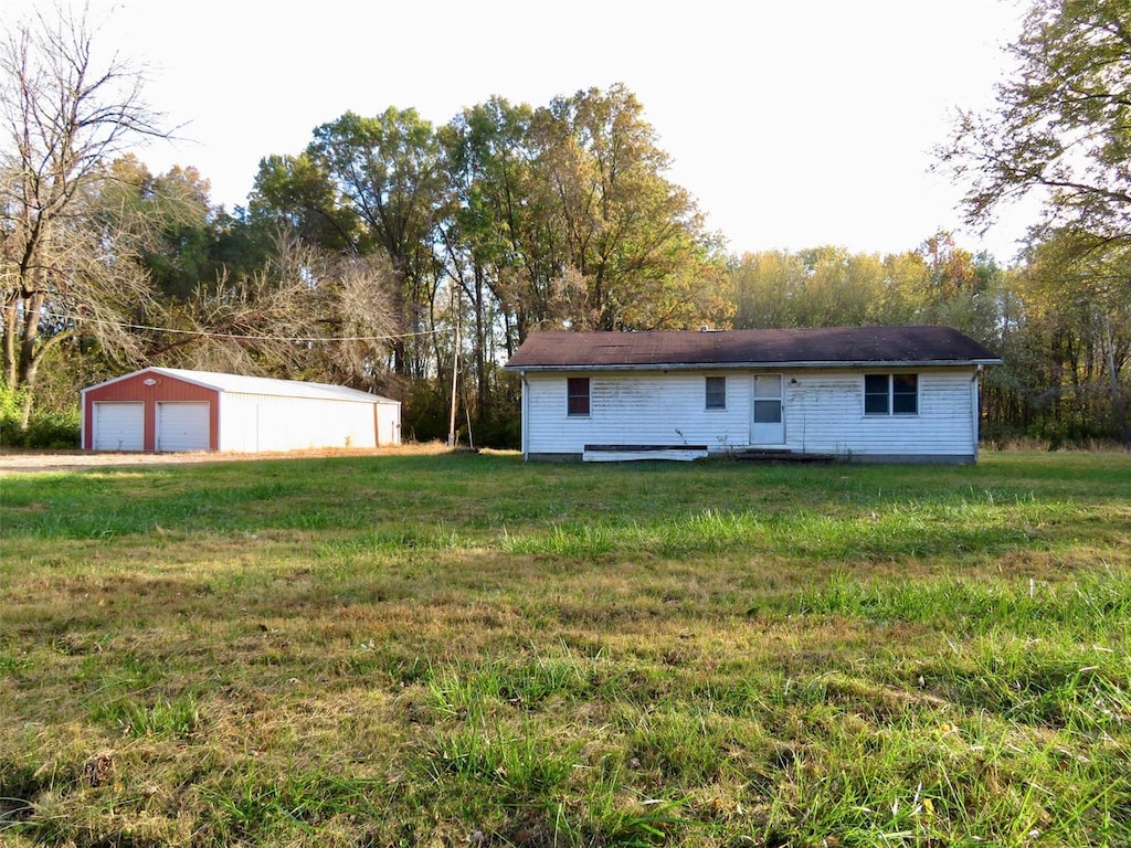 exterior space featuring an outbuilding and a garage