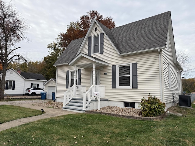 view of front of home featuring central AC and a front lawn