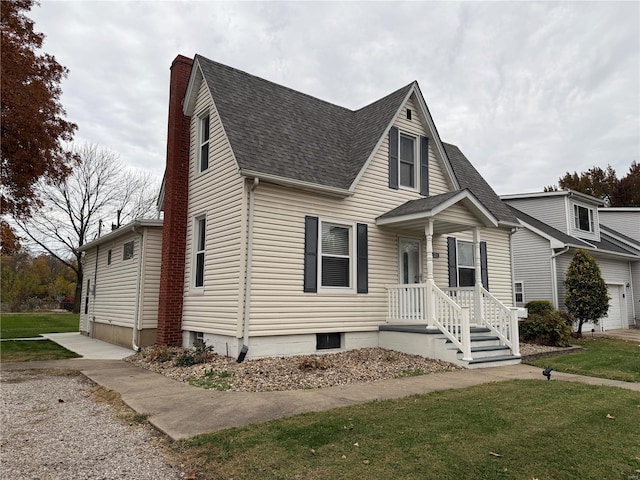 view of front of house with a front lawn and a garage