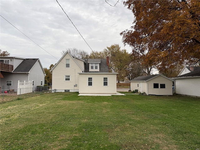 rear view of house with a lawn