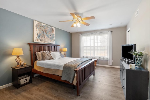 bedroom with wood-type flooring and ceiling fan