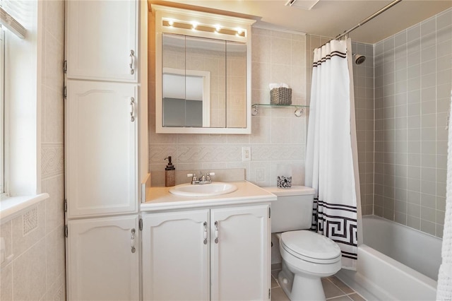 full bathroom with tile walls, vanity, tasteful backsplash, toilet, and shower / bath combo with shower curtain