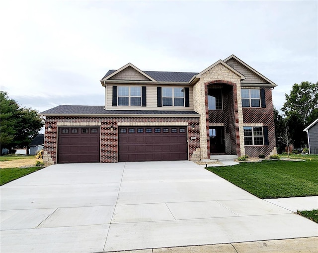 view of front of home featuring a garage and a front yard