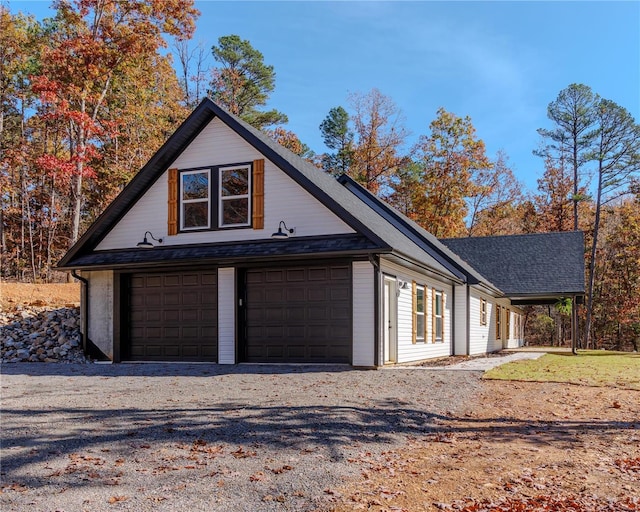 view of side of property with a garage