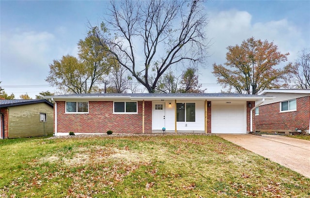 single story home featuring a garage and a front yard