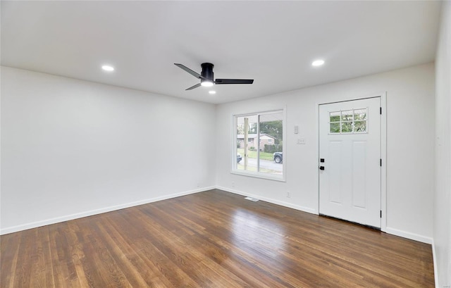 foyer entrance with ceiling fan and dark hardwood / wood-style flooring