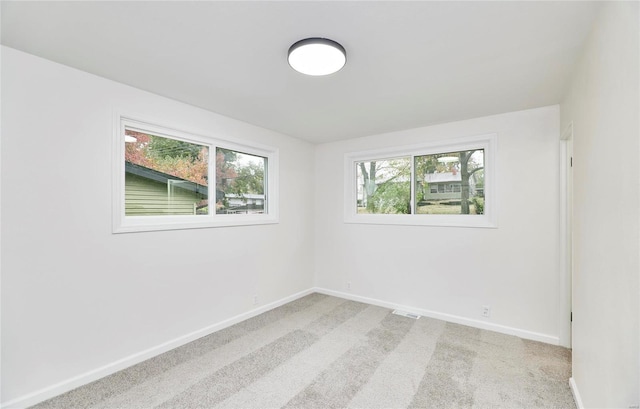 spare room with carpet floors