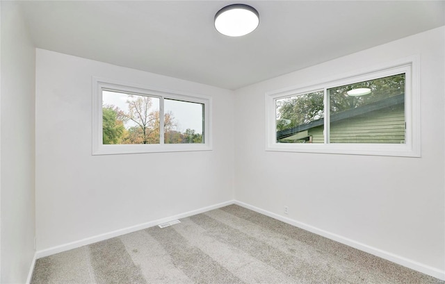 unfurnished room with carpet floors