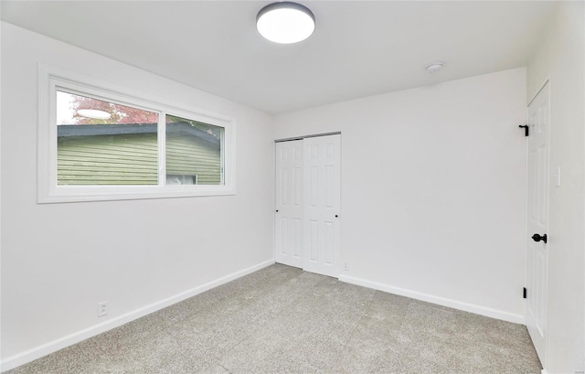 spare room with light colored carpet