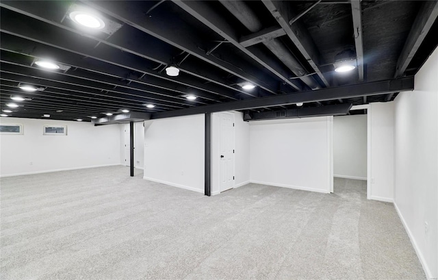 basement with light colored carpet