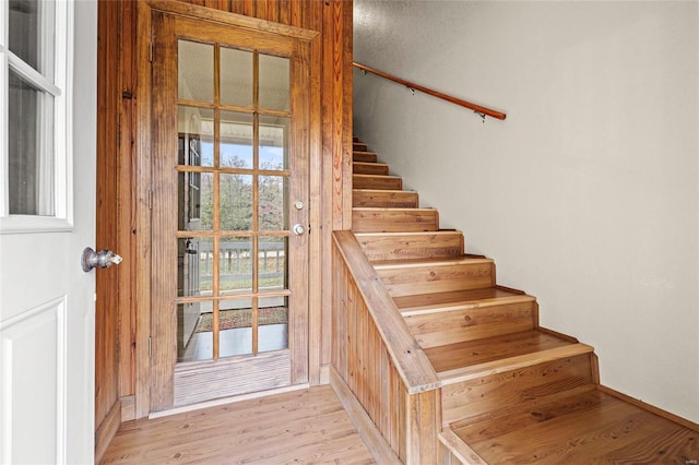 staircase with wood-type flooring