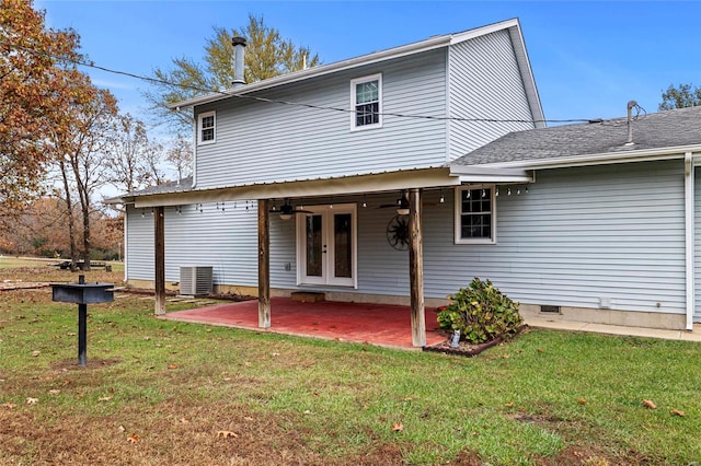 rear view of house featuring central air condition unit, a lawn, ceiling fan, and a patio area