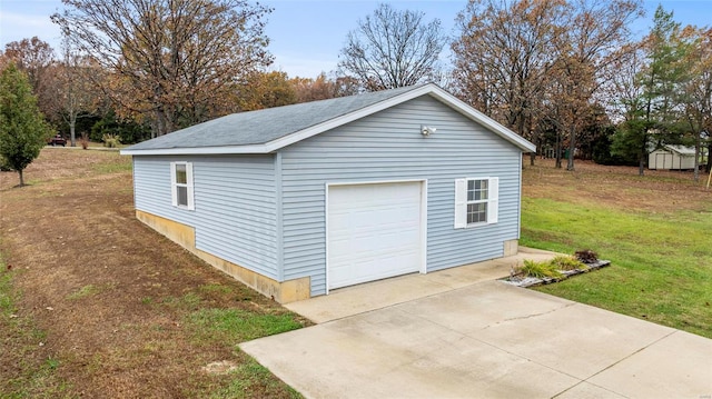 garage with a yard