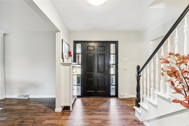 foyer entrance featuring dark hardwood / wood-style floors