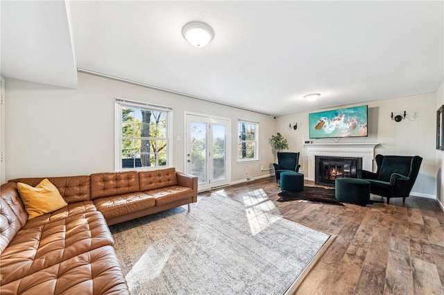 living room featuring wooden walls and hardwood / wood-style floors