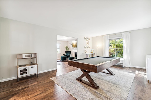 playroom featuring dark hardwood / wood-style floors and pool table