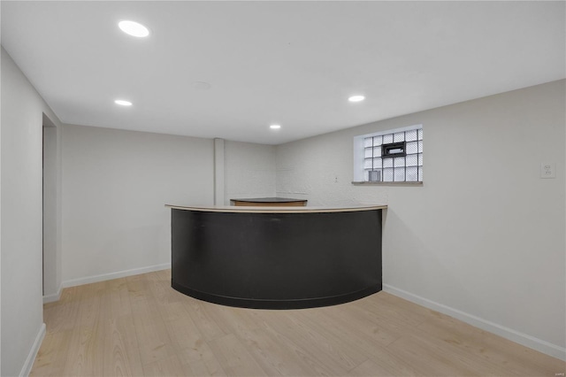 bar with light wood finished floors, recessed lighting, and baseboards