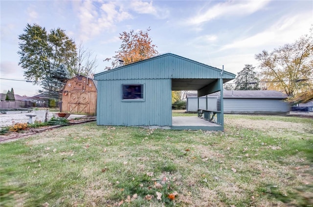 view of outbuilding featuring a yard