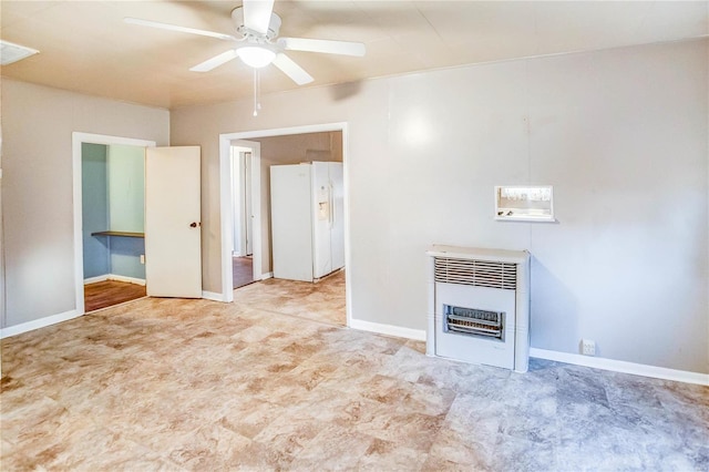 unfurnished living room featuring heating unit and ceiling fan