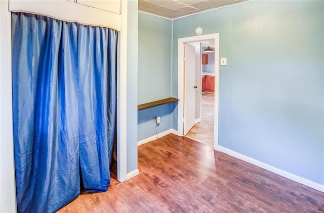 bathroom with wood-type flooring