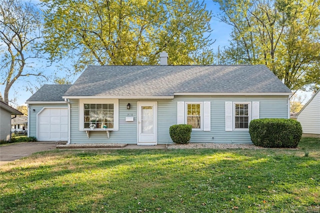 view of front of home featuring a garage and a front lawn