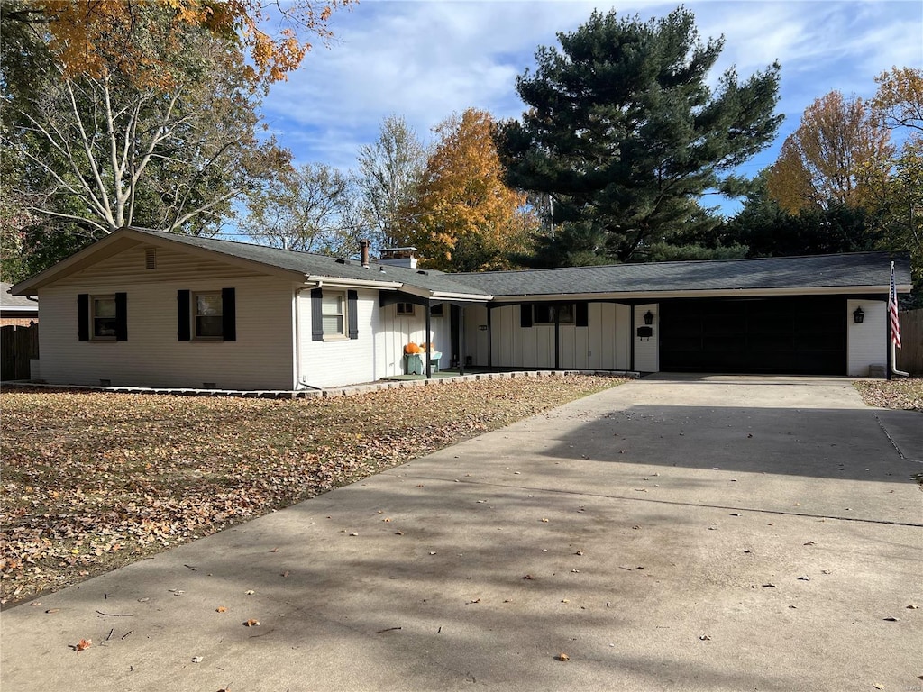 ranch-style house featuring a garage