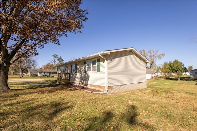 view of side of property with a yard