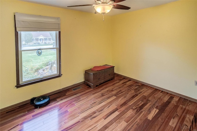 unfurnished room with hardwood / wood-style flooring and ceiling fan