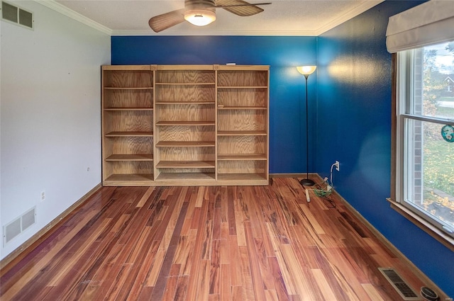 unfurnished room with ornamental molding, dark hardwood / wood-style floors, and ceiling fan