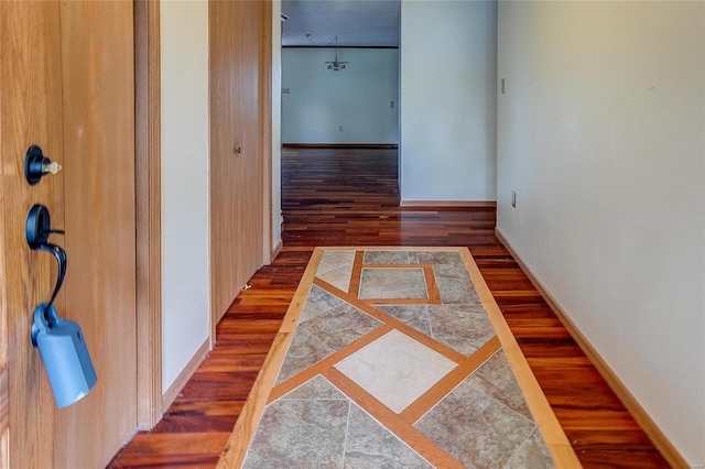 hallway featuring dark hardwood / wood-style floors