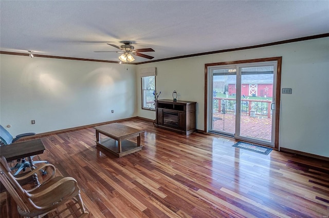 living room featuring a textured ceiling, hardwood / wood-style flooring, ceiling fan, and plenty of natural light