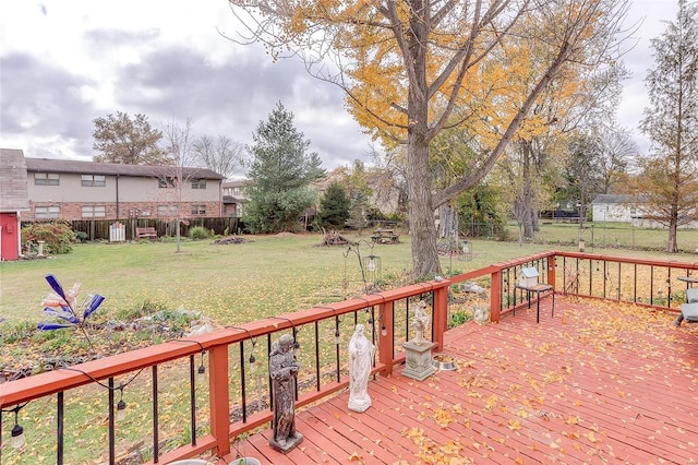 wooden deck with a lawn