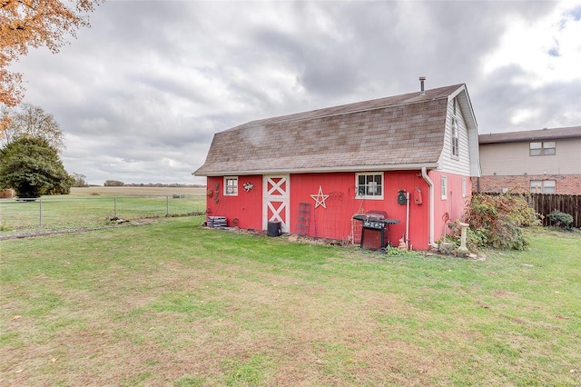 view of outbuilding with a yard