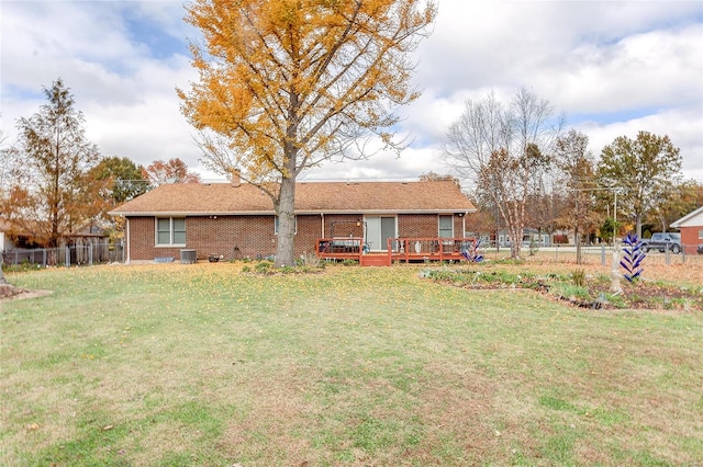 view of yard with a deck and central AC