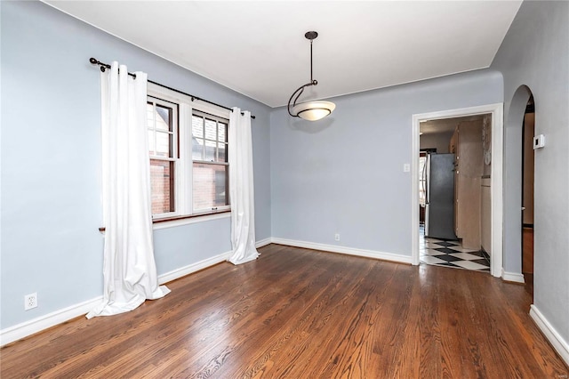 unfurnished dining area with dark hardwood / wood-style flooring