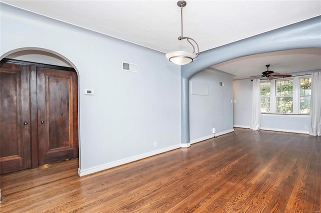 unfurnished room featuring hardwood / wood-style floors and ceiling fan