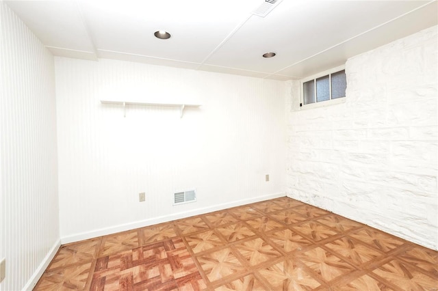 basement featuring parquet flooring