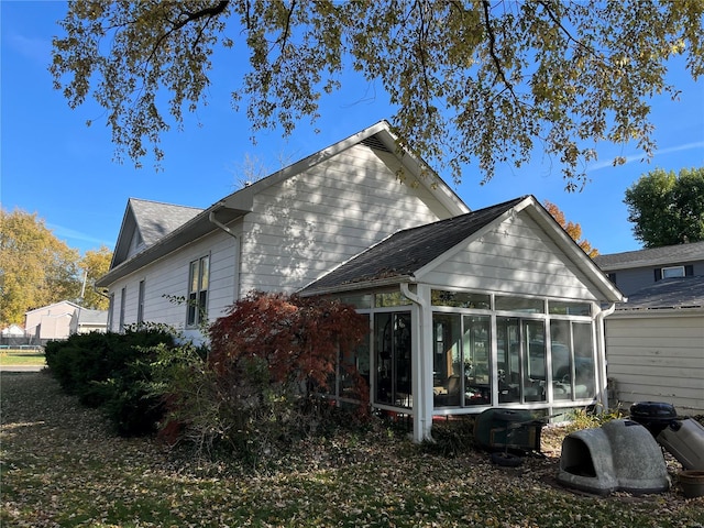 rear view of house with a sunroom