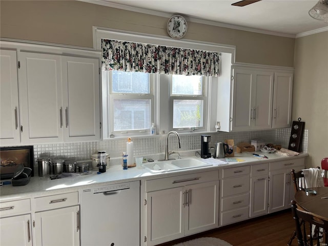 kitchen featuring dishwasher, dark wood-type flooring, sink, white cabinets, and tasteful backsplash