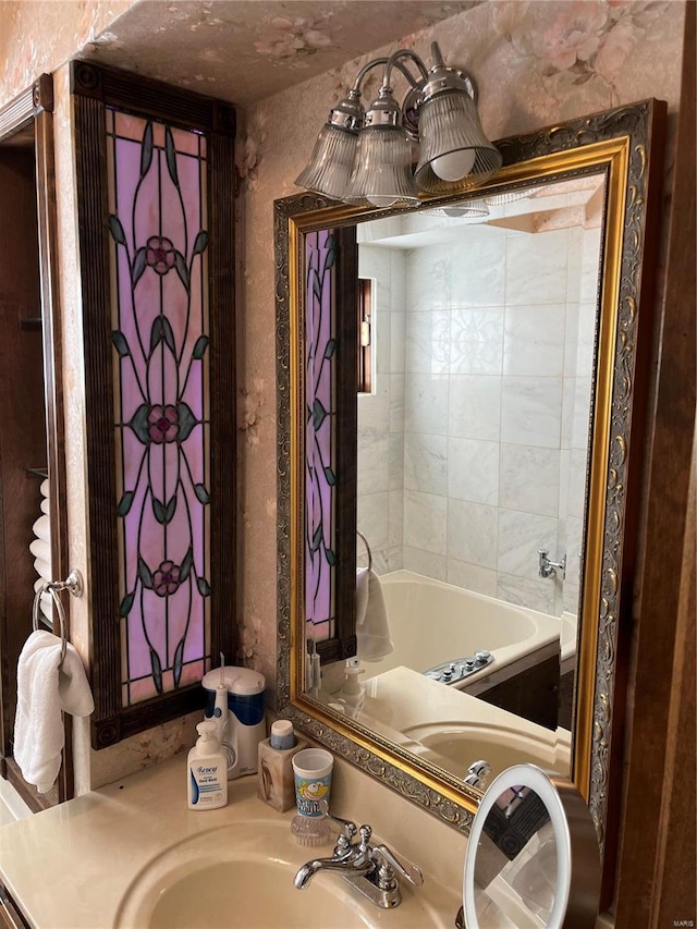 bathroom featuring vanity and a bathtub