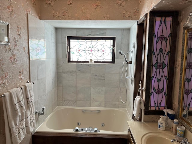 bathroom with vanity and tiled shower / bath