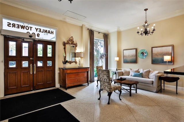 foyer entrance with a notable chandelier and crown molding