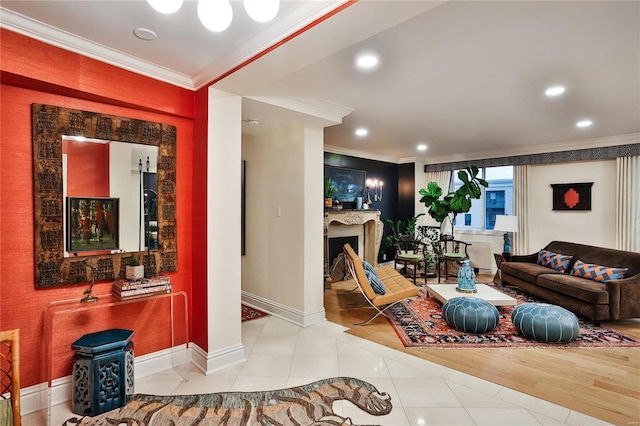 living room featuring ornamental molding and light hardwood / wood-style floors