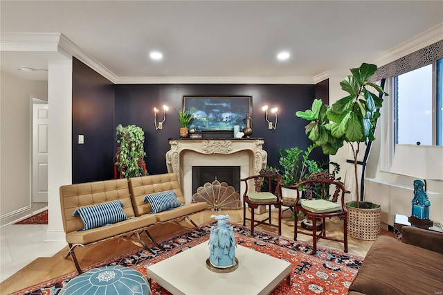 living room with tile patterned floors, a premium fireplace, and crown molding